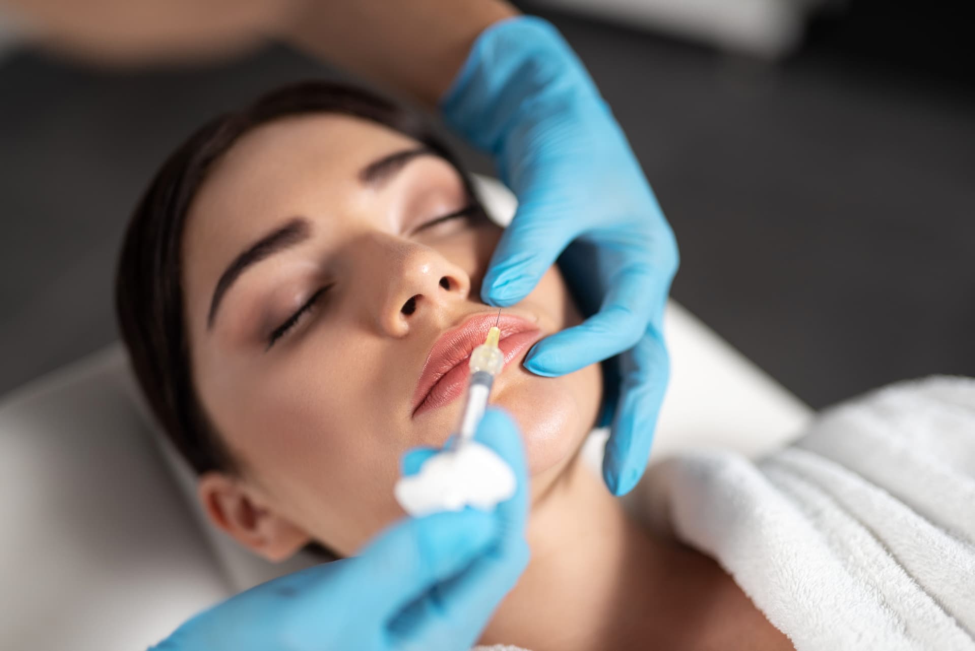 Lip filler injection performed by a clinician